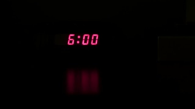 clock turns off alarm clock and turns on hotel light