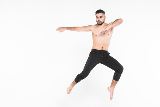 Full length of man  ballet dancer leaping in mid air isolated on white background.