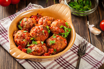 Pork meatballs with spicy tomato sauce in dish