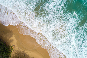 Fototapeta na wymiar Beach aerial view with turquoise sea wave