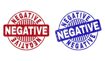 Grunge NEGATIVE round stamp seals isolated on a white background. Round seals with grunge texture in red and blue colors. Vector rubber watermark of NEGATIVE title inside circle form with stripes.