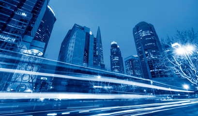 Fototapeta premium Urban Nightscape Architecture Street and Fuzzy Car Lights..