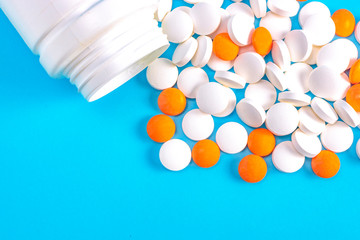 scattered pills on a blue background