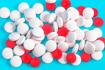 scattered pills on a blue background