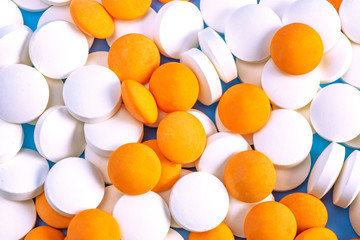 scattered pills on a blue background