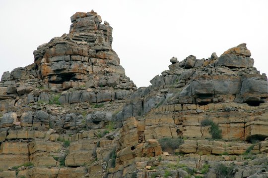 Unique compressed rock layers formation in various colors, Nature and Geological background.