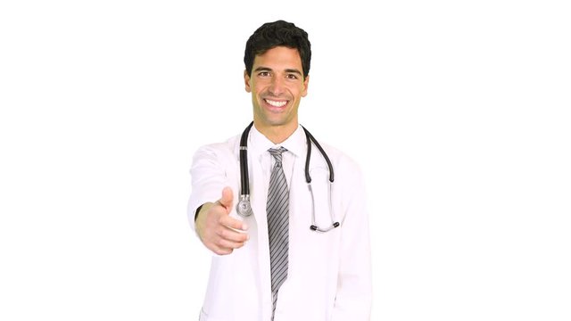 Portrait of a smiling handsome doctor giving a handshake isolated on white