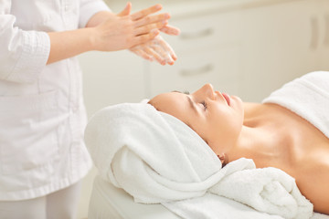Fototapeta na wymiar Facial massage for a young woman
