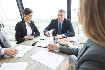 Workers at business meeting