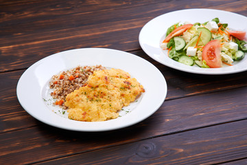 fried chicken breast with buckwheat and salad