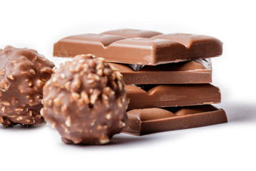 Chocolate Bar and Chocolate Bonbons on White Background
