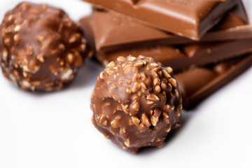 Chocolate Bar and Chocolate Bonbons on White Background