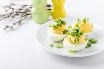 Creamy deviled eggs on festive Easter table
