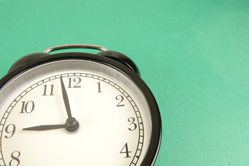 Time Punctuality Concept with black alarm clock.