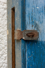 Wooden blue mailbox with a locker