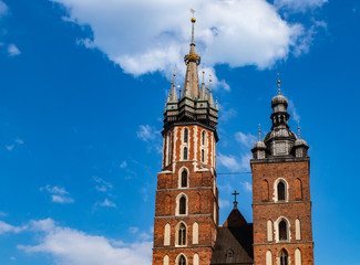 Fototapeta na wymiar Towers of St. Mary's Church on the Main Square in Krakow, Poland