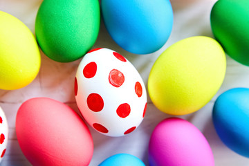 Fototapeta na wymiar Colorful Easter eggs on wooden background
