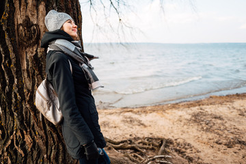 young beautiful girl is resting in nature, woman is walking outdoors