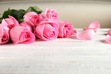 Bouquet of roses on a wooden background