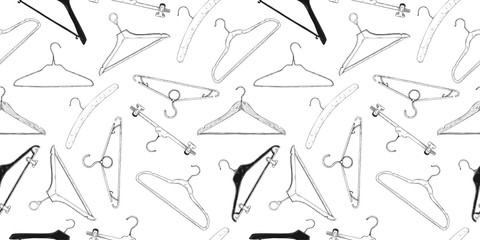 Seamless pattern with clothes hangers. Hand drawn, isolated on a white background. Vector