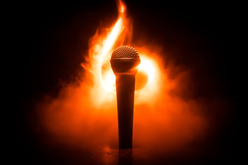 Microphone karaoke, concert . Vocal audio mic in low light with blurred background. Live music,...