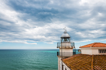 Fototapeta na wymiar Lighthouse of the fortified city of Peniscola