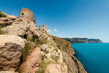 Fototapeta na wymiar Fortress on a rock by the sea.