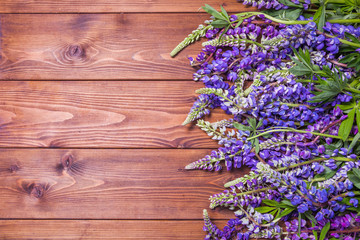 Wooden background with lupines