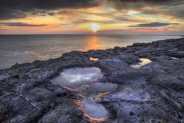 Sunset at Witches Point at Dunraven bay on the Welsh Heritage Coast, South Wales, UK