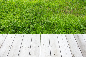 Background wooden and background grass.