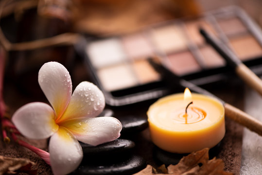Professional makeup brushes and tools, natural make-up products set on white table with pomelia flower