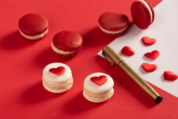 Red Macarons and red shaped hearten an envelope