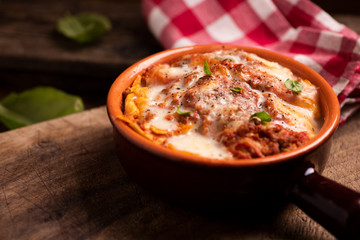 Lasagna bolognese served in a pot