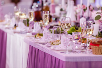 Table set for an event party or wedding reception. Wedding table setting. wine glasses