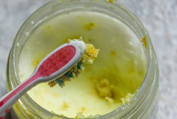 toothbrush with coconut oil and turmeric