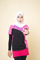 Sport Girl Wearing a Black/Pink Shirt and White Shawl is Running with a Baton