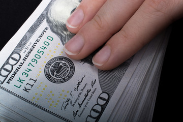Hand holding American dollar  isolated on white background