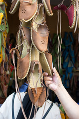 Fototapeta na wymiar Set of traditional hand made leather shoes in bazaar