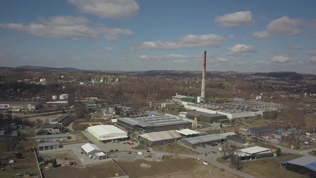 Gorlice, Poland - 3 9 2019: Industrial region of the Carpathian city. Top view of the refinery and auxiliary buildings. Video shot by drone or quadrocopter. Vanity of the day at the factory. Planning 