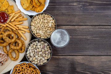 Mix of snacks with beer. Top view, Empty space for text