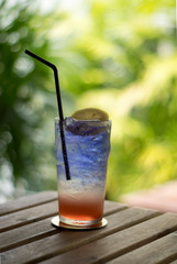 blue Italian soda, lemonade water with ice and lime lemon slice