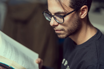 Young computer science student reads an advanced robotics book in Caceres, Spain.