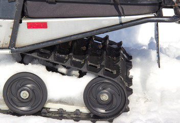 Fototapeta na wymiar rollers of the snowmobile on snow
