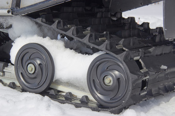 rollers of the snowmobile on snow