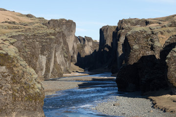 Fototapeta premium Fjadrargljufur is a canyon in south east Iceland.Fjadrargljufur canyon was created by progressive erosion by flowing water from glaciers through the rocks over a long period of time