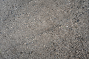 Concrete wall texture with embedded stones and pebbles - Solid sand stone mortar surface background with flint and brick encased