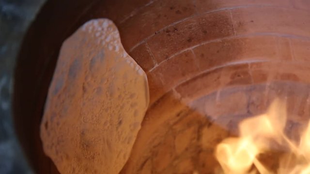 Cooking bread in the  tandoori