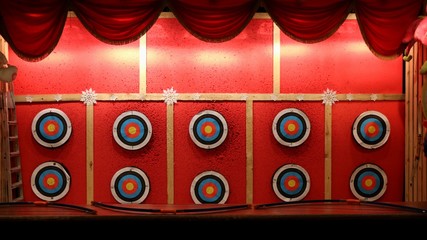longbows and archery targets in amusement park.