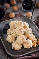 Snack cheese balls with prunes and walnuts, selective focus