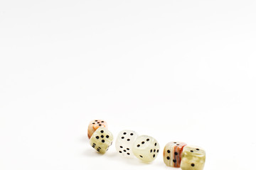 Dices made of natural stone on a white background. Copy space. Gaming.